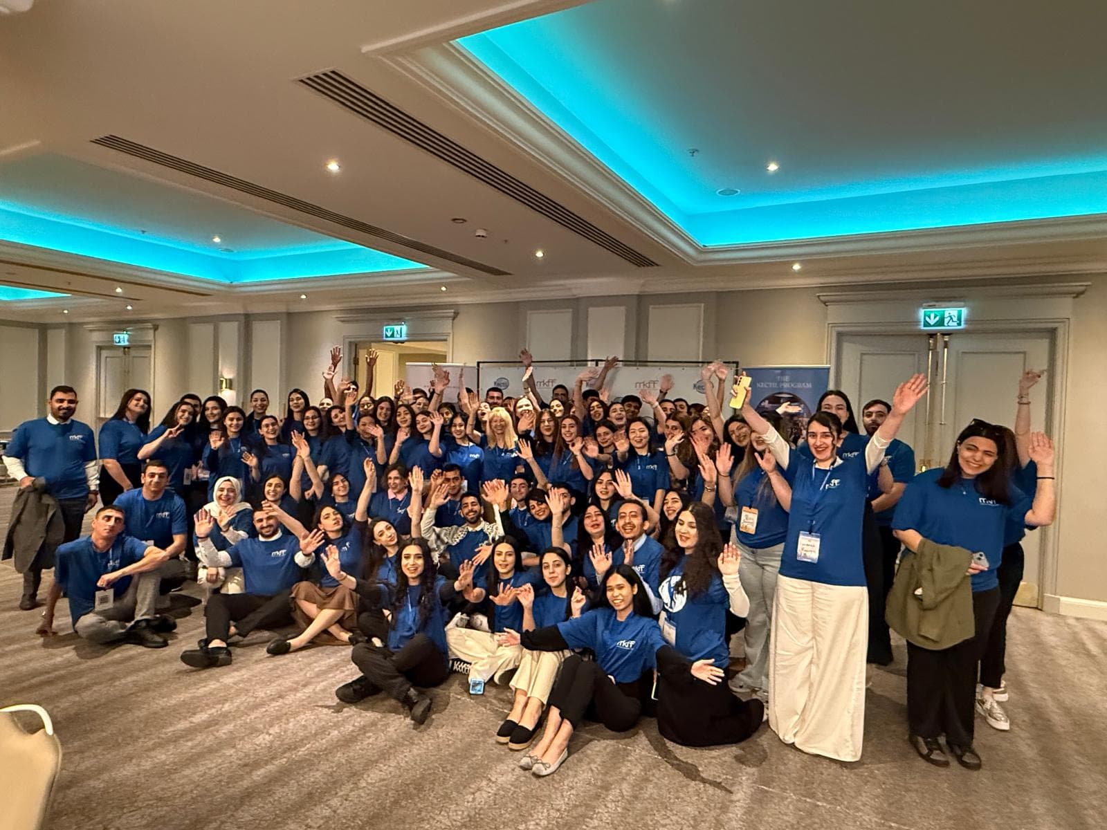 Kectil program participants waving together after a gathering.